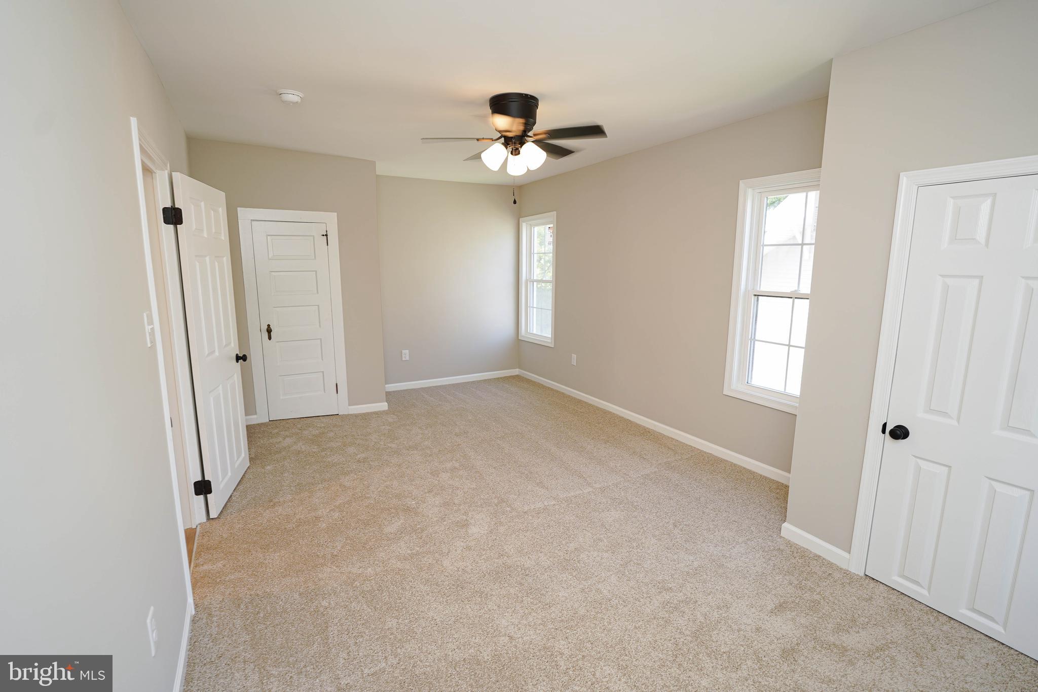 406 Delaware Avenue Delmar, DE 19940 - Photo 24 of 48 wooden floor in an empty room with a window