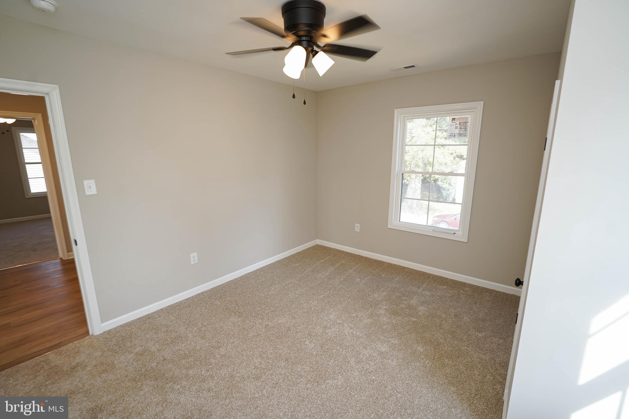 406 Delaware Avenue Delmar, DE 19940 - Photo 31 of 48 a view of an empty room with a window