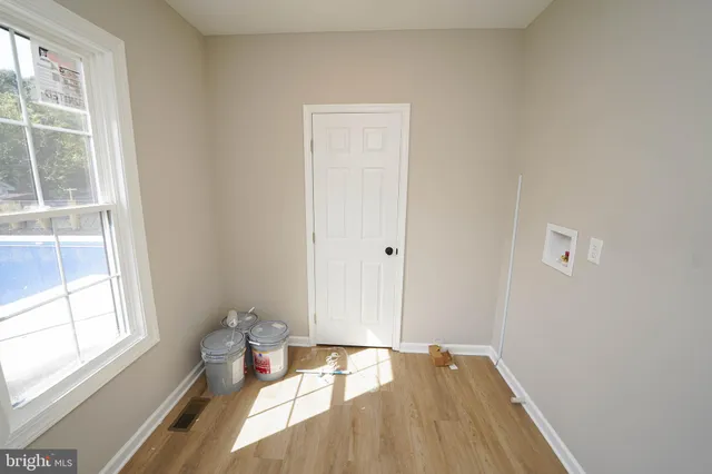 a view of an empty room and window