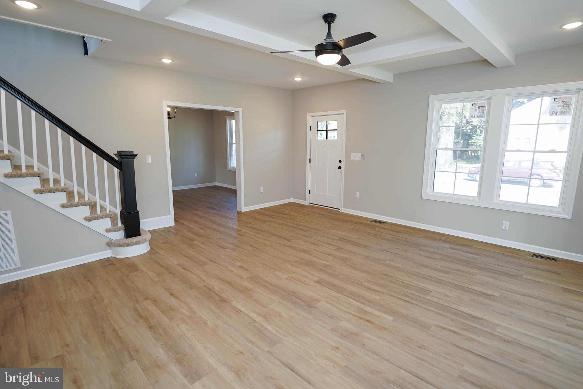 406 Delaware Avenue Delmar, DE 19940 - Photo 4 of 48 wooden floor in an empty room with a window