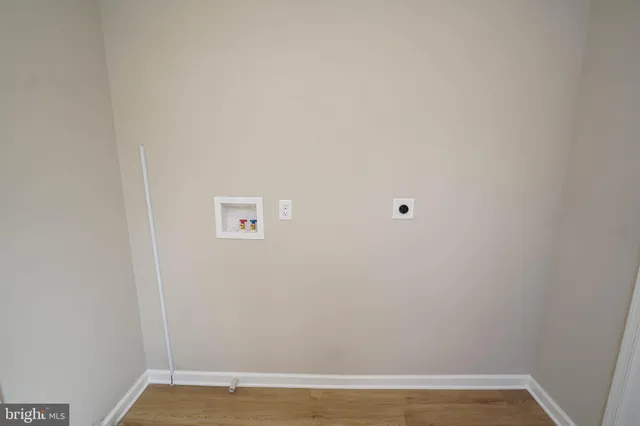 a view of a small space with wooden floor