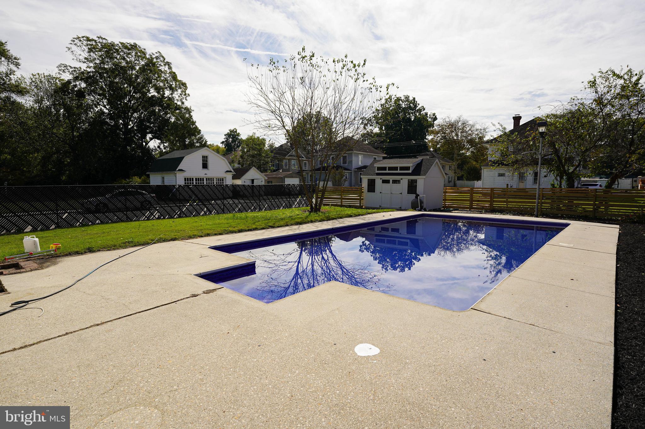 406 Delaware Avenue Delmar, DE 19940 - Photo 45 of 48 a view of swimming pool with a yard