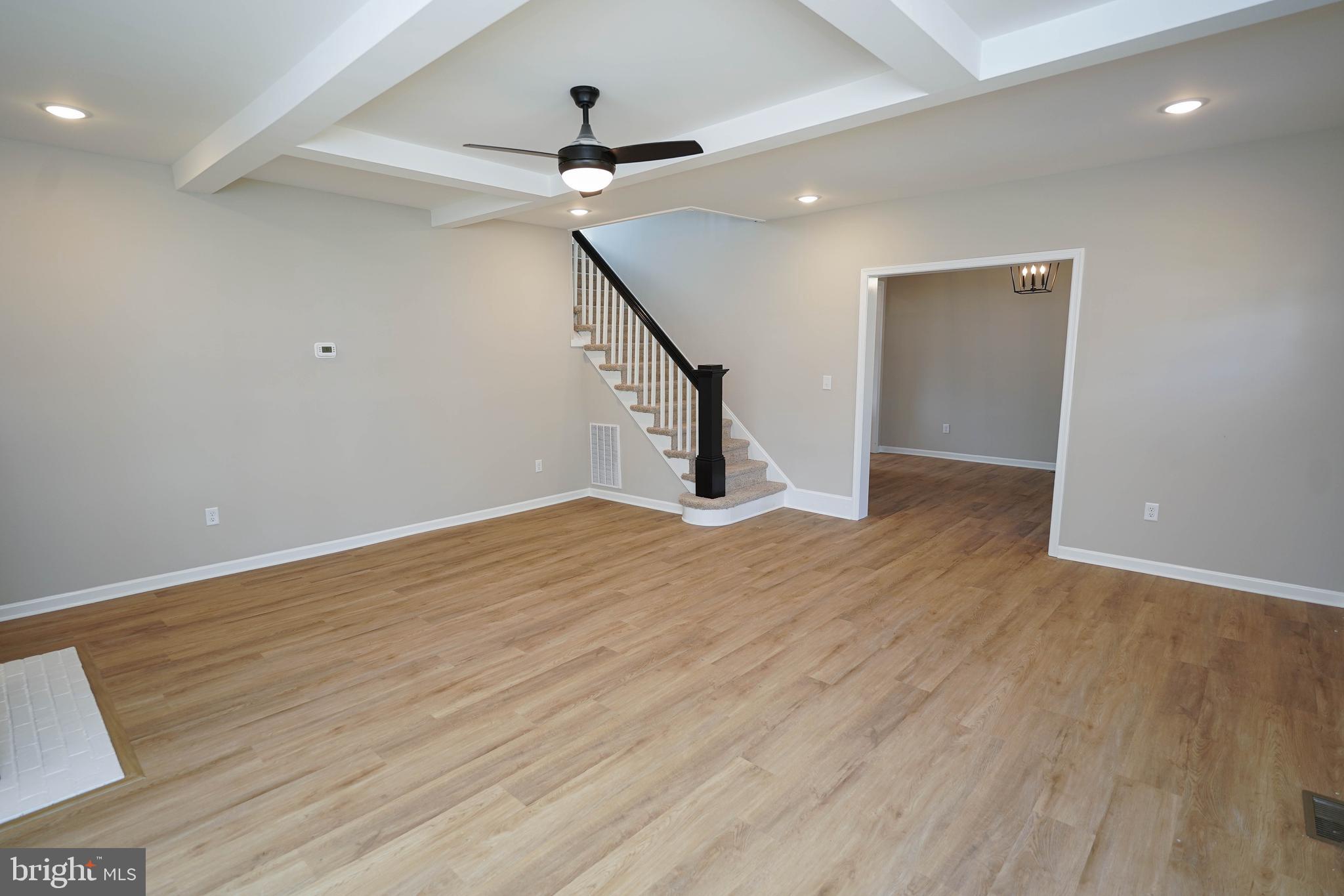 406 Delaware Avenue Delmar, DE 19940 - Photo 7 of 48 a view of empty room with wooden floor and fan