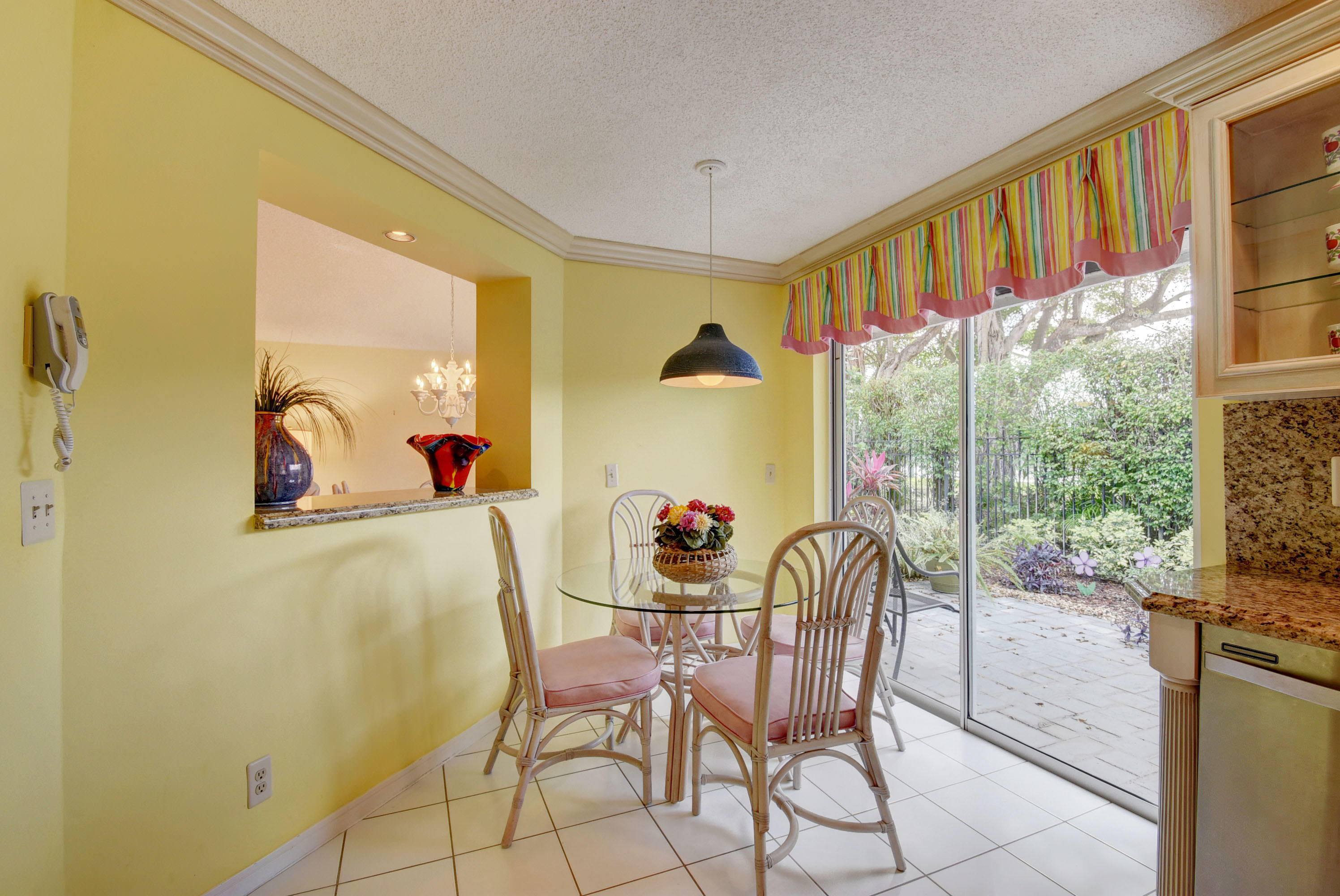 2254 Northwest 52nd Street Boca Raton, FL 33496 - Photo 12 of 28 a dining room with furniture and a floor to ceiling window