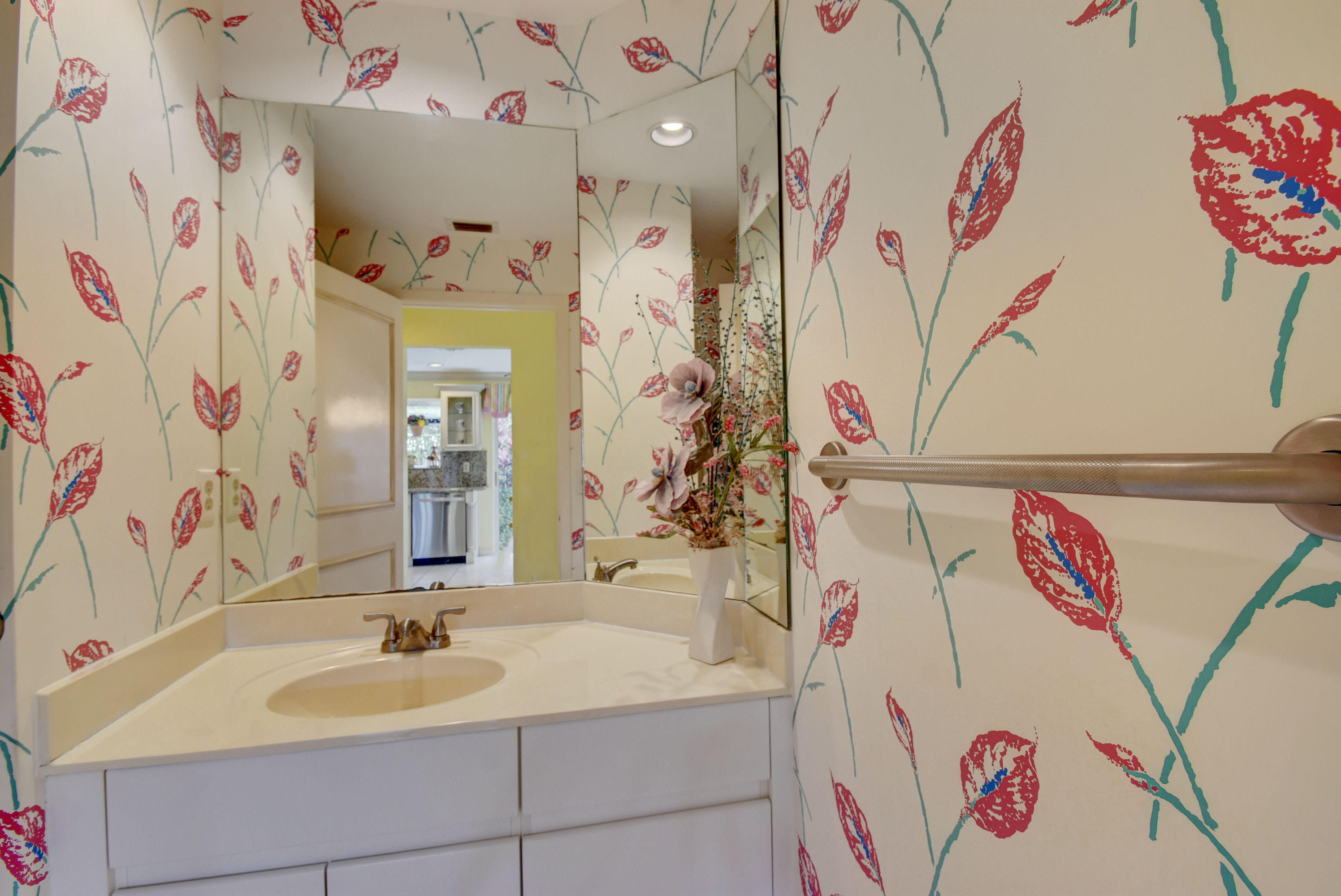 2254 Northwest 52nd Street Boca Raton, FL 33496 - Photo 13 of 28 a bathroom with a sink and a mirror