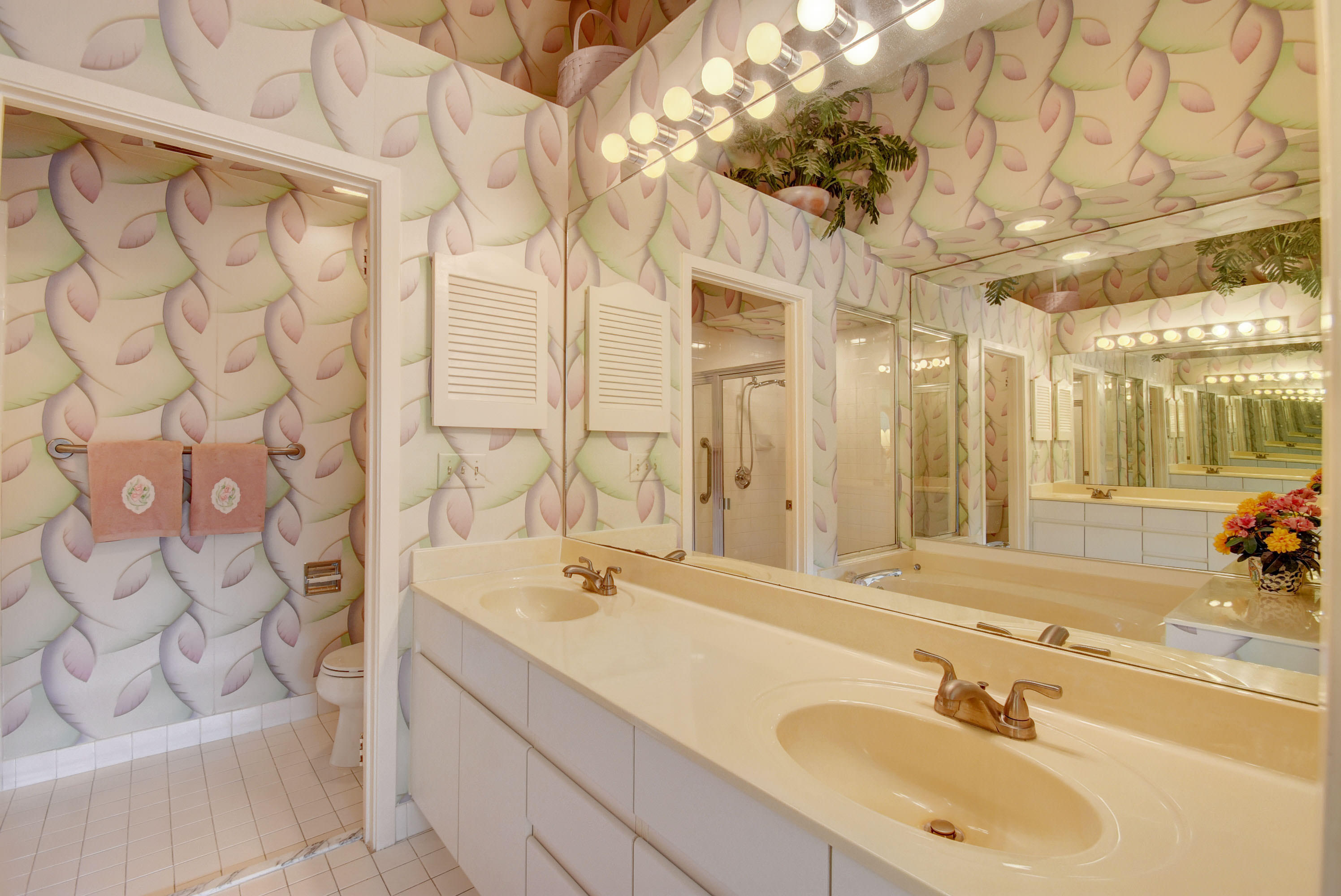 2254 Northwest 52nd Street Boca Raton, FL 33496 - Photo 16 of 28 a bathroom with a sink and a mirror