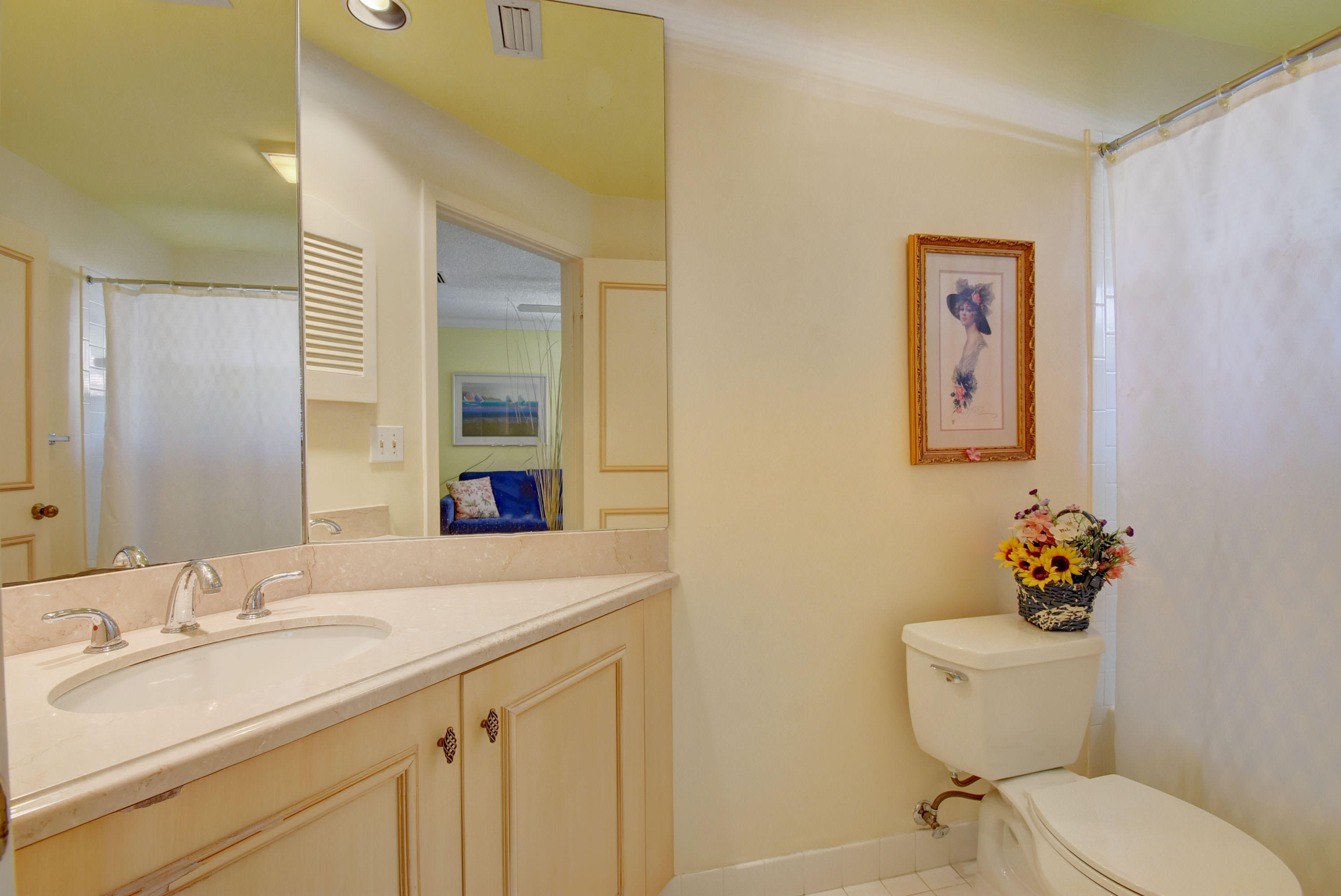 2254 Northwest 52nd Street Boca Raton, FL 33496 - Photo 20 of 28 a bathroom with a toilet sink and mirror