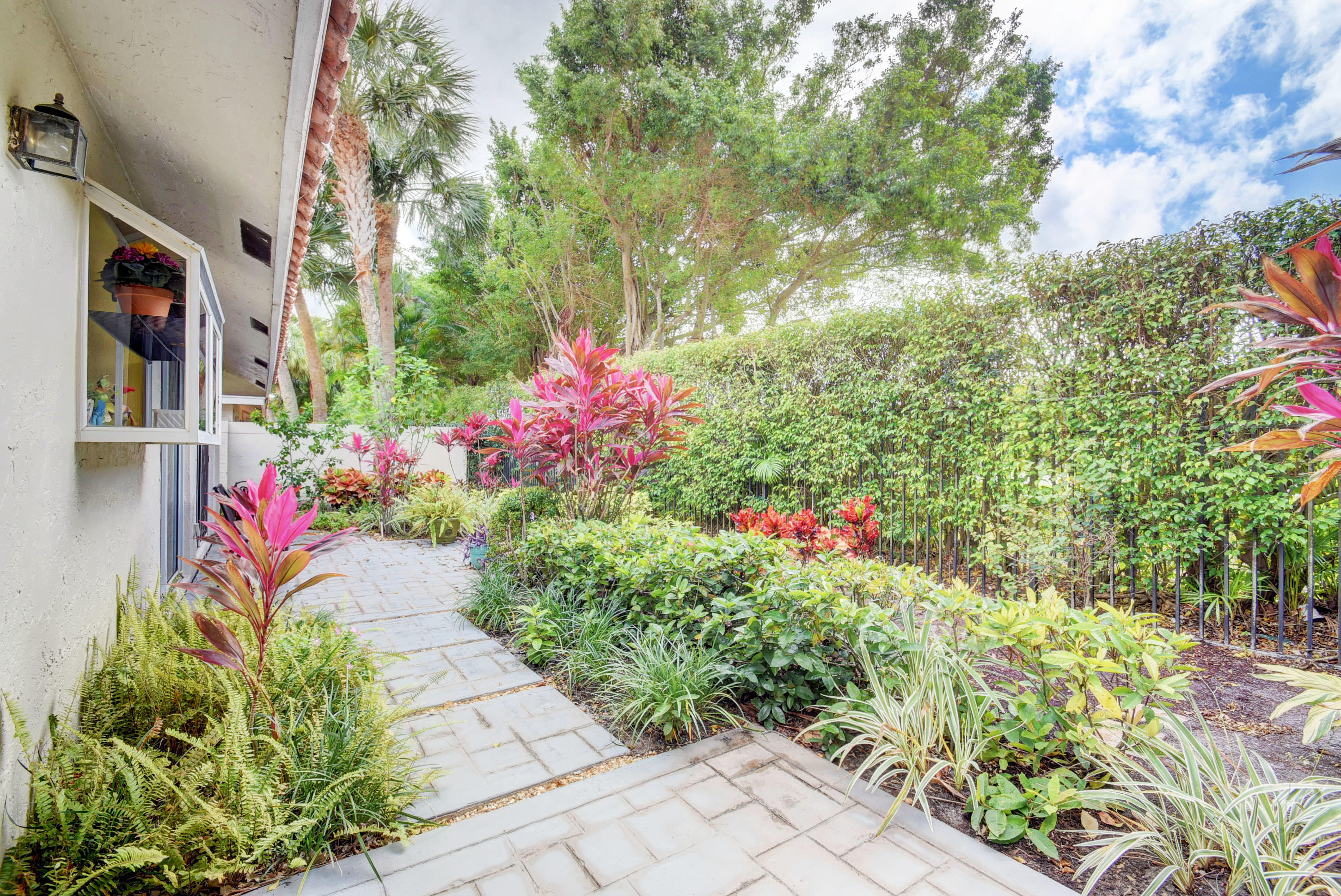 2254 Northwest 52nd Street Boca Raton, FL 33496 - Photo 25 of 28 a view of a flower arrangement in backyard of a house