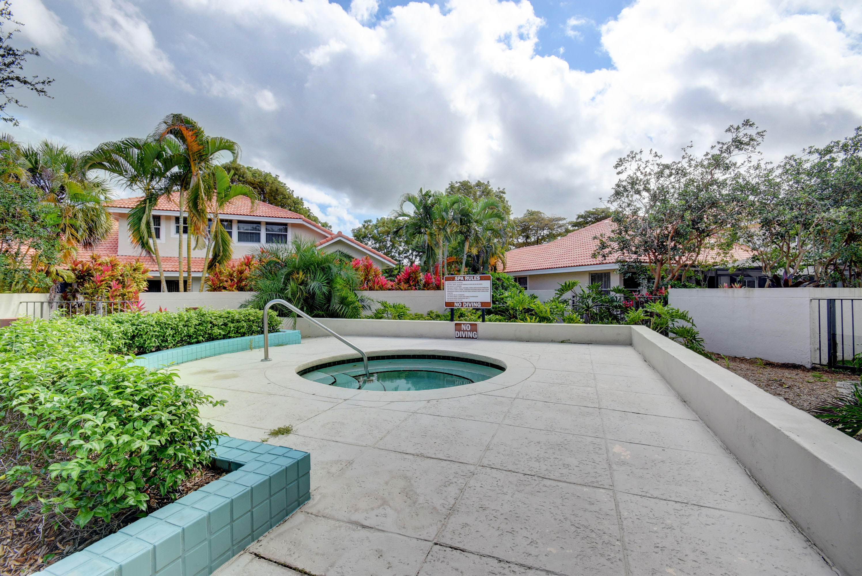 2254 Northwest 52nd Street Boca Raton, FL 33496 - Photo 28 of 28 a view of a street with a houses in the background