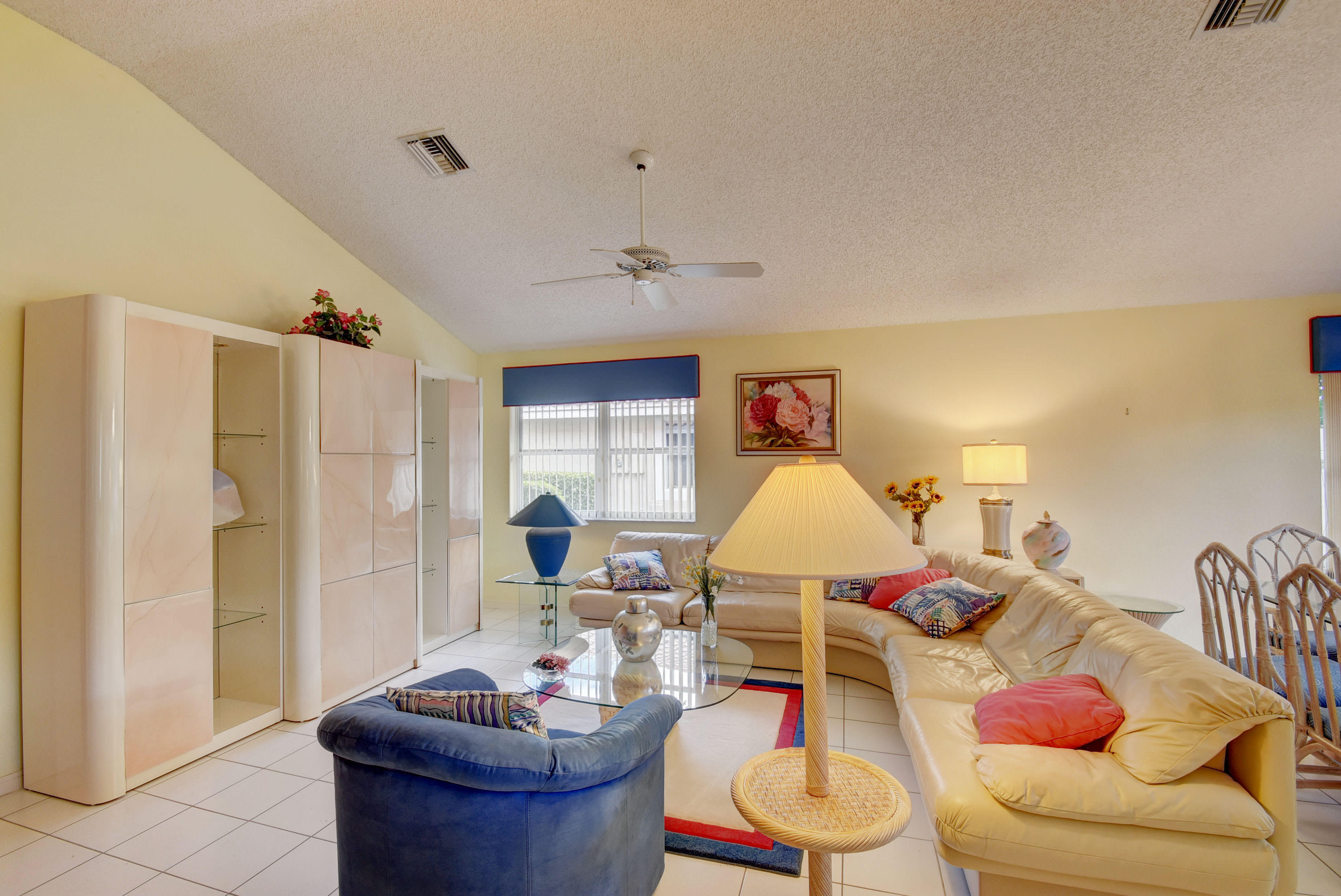 2254 Northwest 52nd Street Boca Raton, FL 33496 - Photo 6 of 28 a living room with furniture and a table