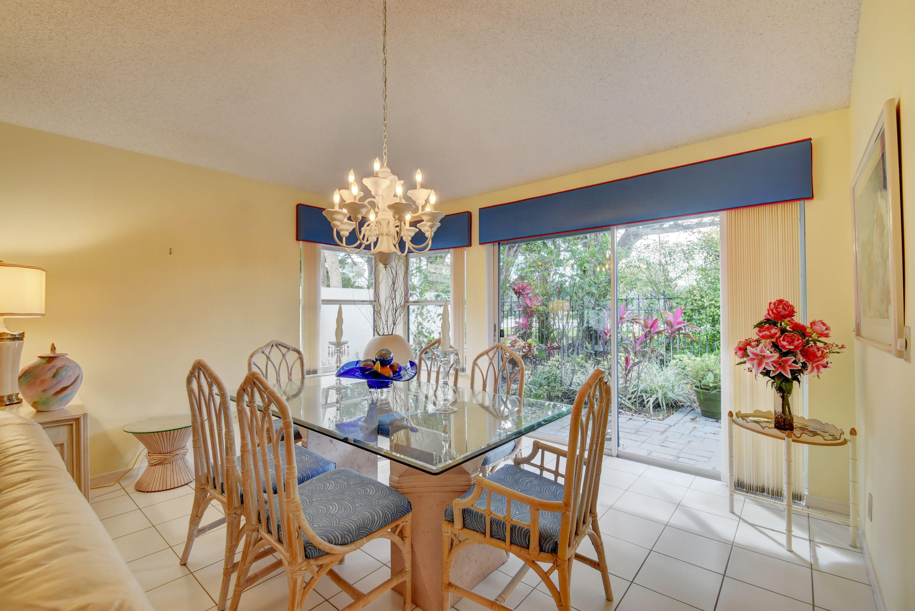 2254 Northwest 52nd Street Boca Raton, FL 33496 - Photo 8 of 28 a dining room with furniture and chandelier kitchen view