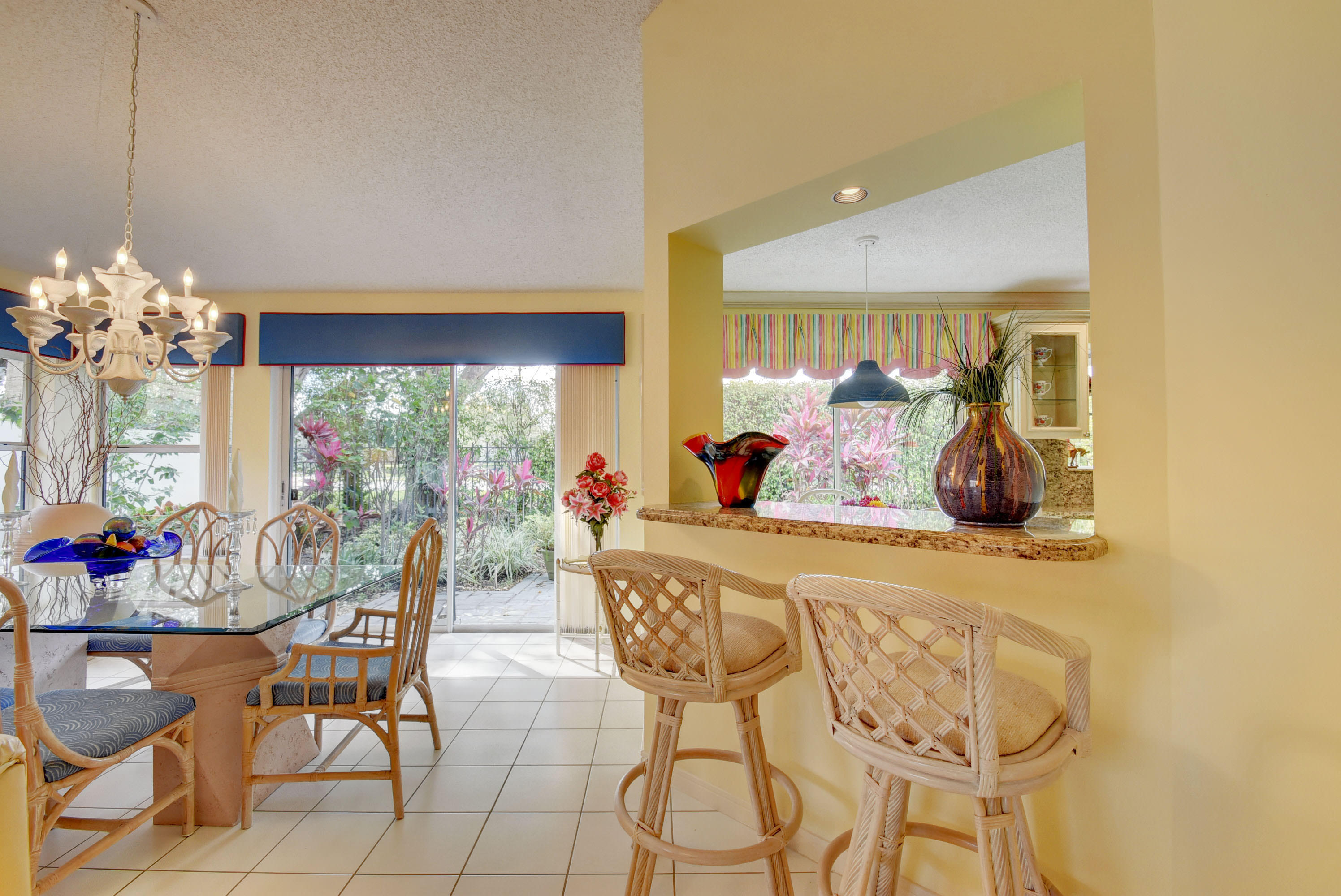 2254 Northwest 52nd Street Boca Raton, FL 33496 - Photo 9 of 28 a view of a dining room with furniture and chandelier