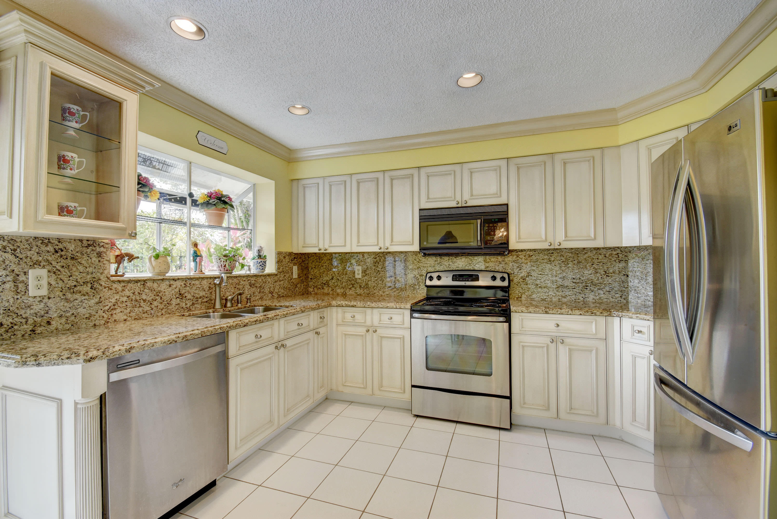 2254 Northwest 52nd Street Boca Raton, FL 33496 - Photo 10 of 28 a kitchen with a sink stove and refrigerator