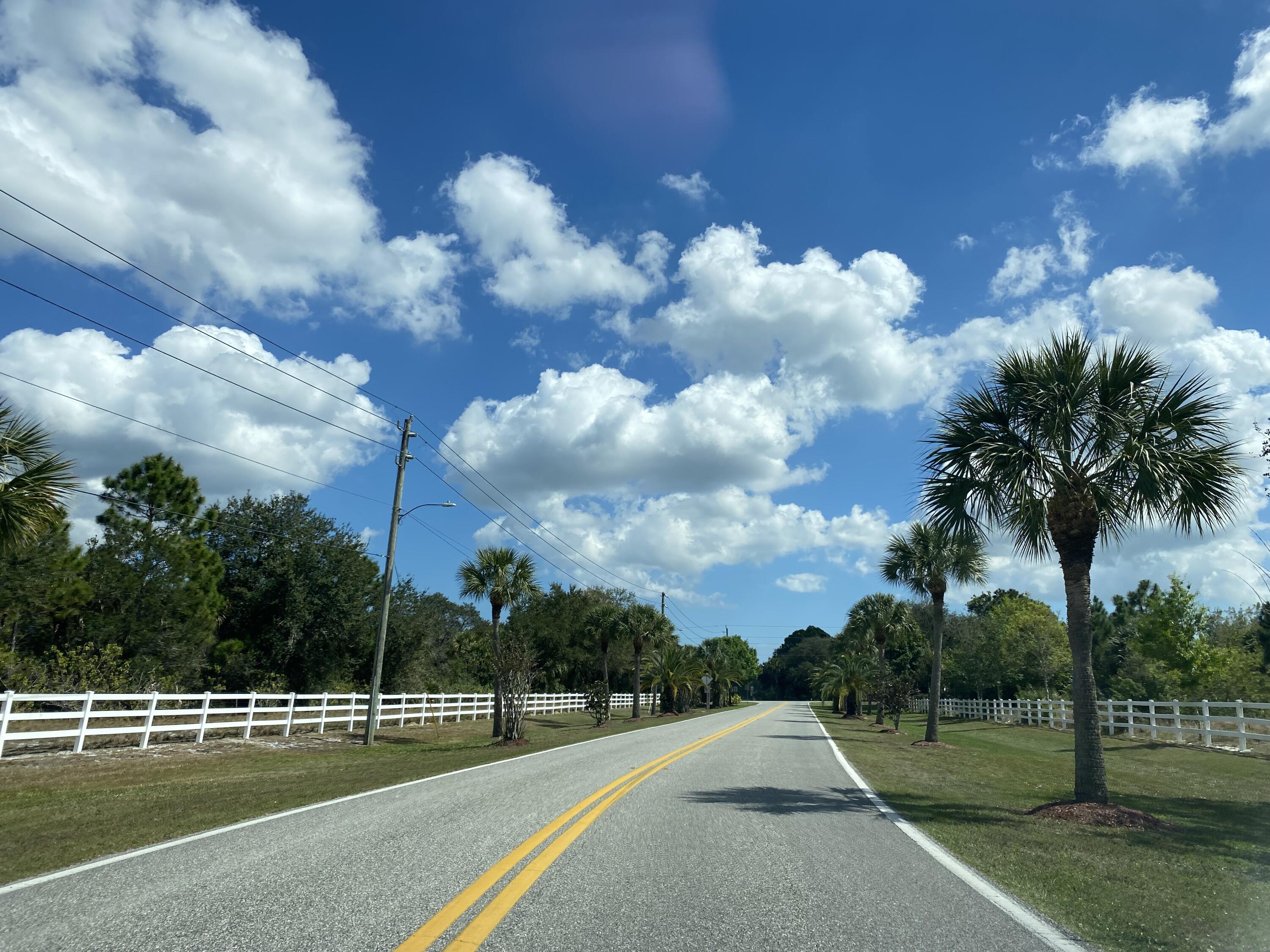 342 Trotters Street Palm Bay, FL 32909 - Photo 4 of 7 a view of a golf course with a lake