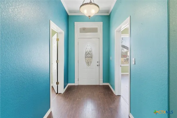 a view of a livingroom with wooden floor and window