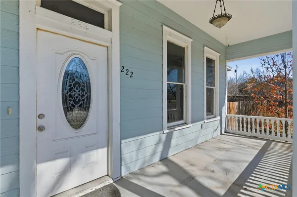 a view of a entryway door with wooden floor