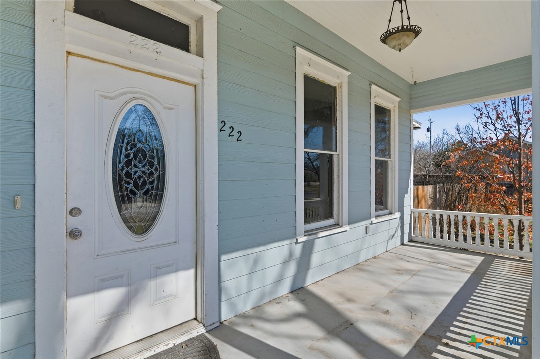 222 East Cedar Street Seguin, TX 78155 - Photo 3 of 46 a view of a entryway door with wooden floor