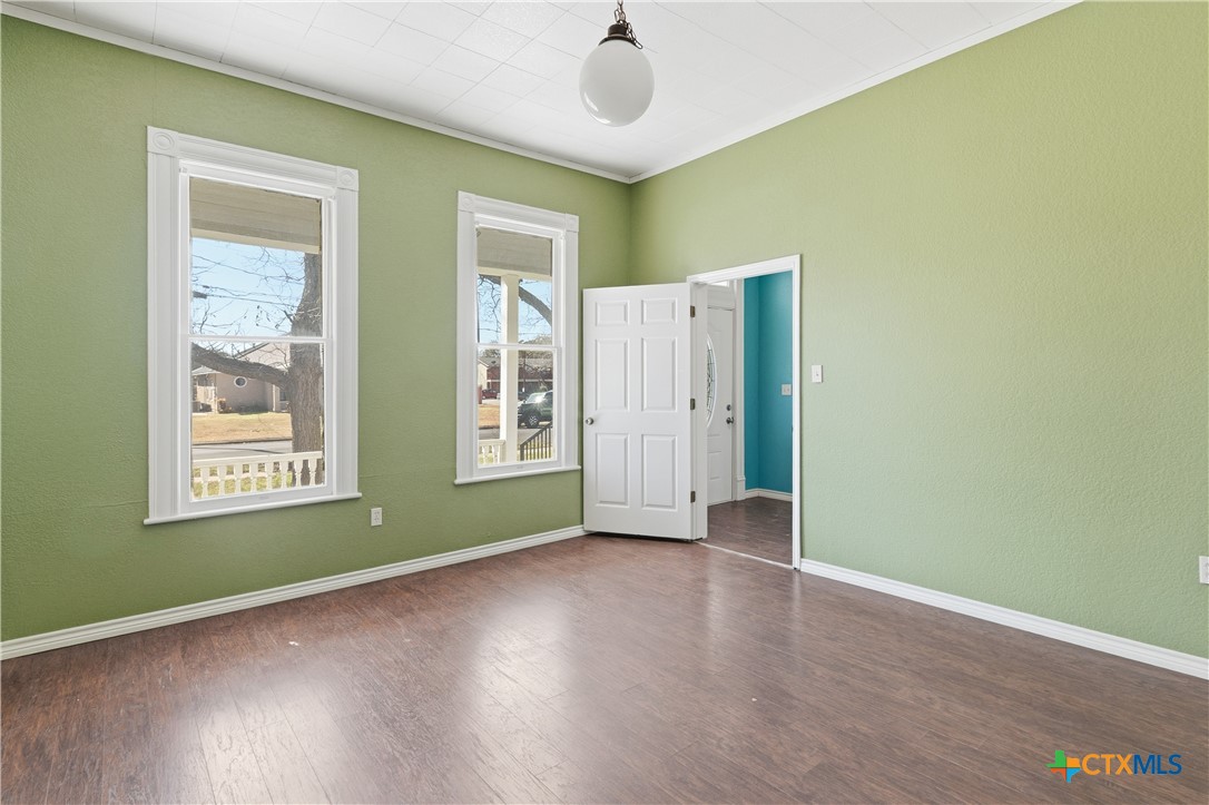 222 East Cedar Street Seguin, TX 78155 - Photo 31 of 46 a view of an empty room with window and wooden floor