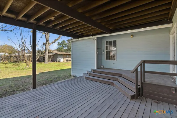 a view of a porch and wooden floor