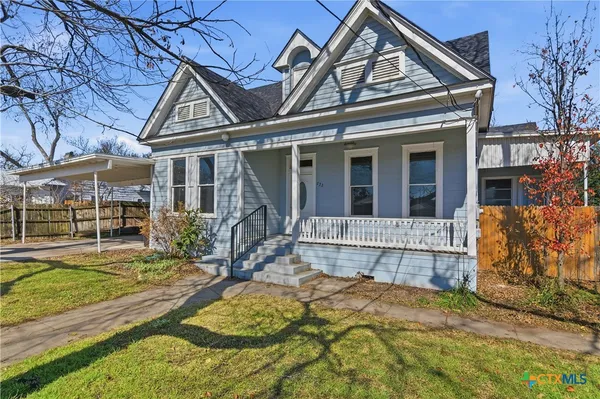 front view of a house with a yard