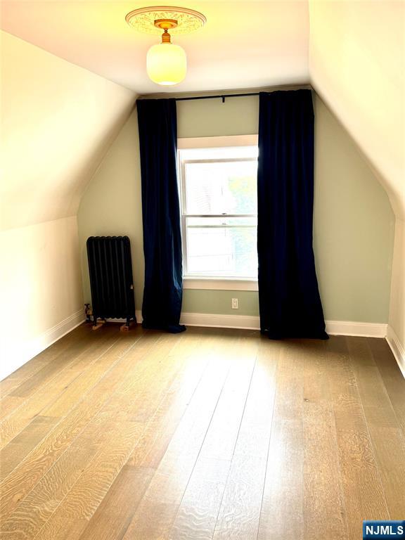 21 Valley Place, Unit 3 Edgewater, NJ 07020 - Photo 8 of 18 an empty room with wooden floor and windows