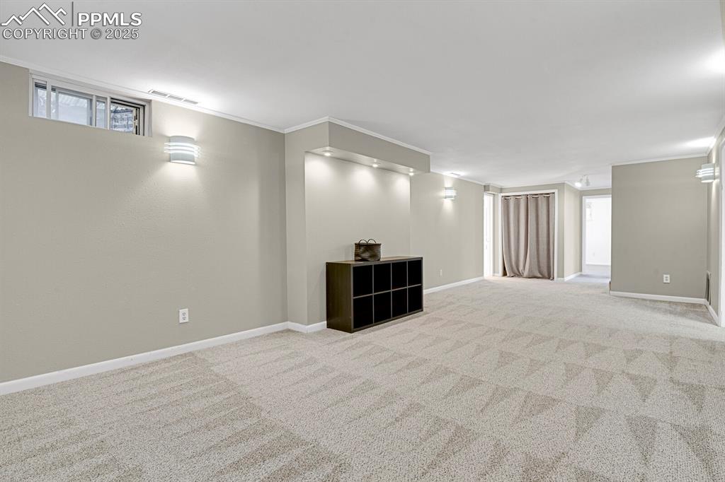 1417 Prairie Road Colorado Springs, CO 80909 - Photo 21 of 34 a large room with closet and windows