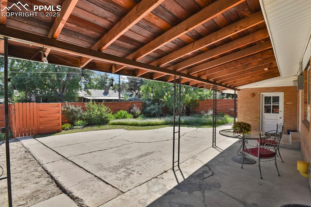 1417 Prairie Road Colorado Springs, CO 80909 - Photo 30 of 34 a patio with yard table and chairs