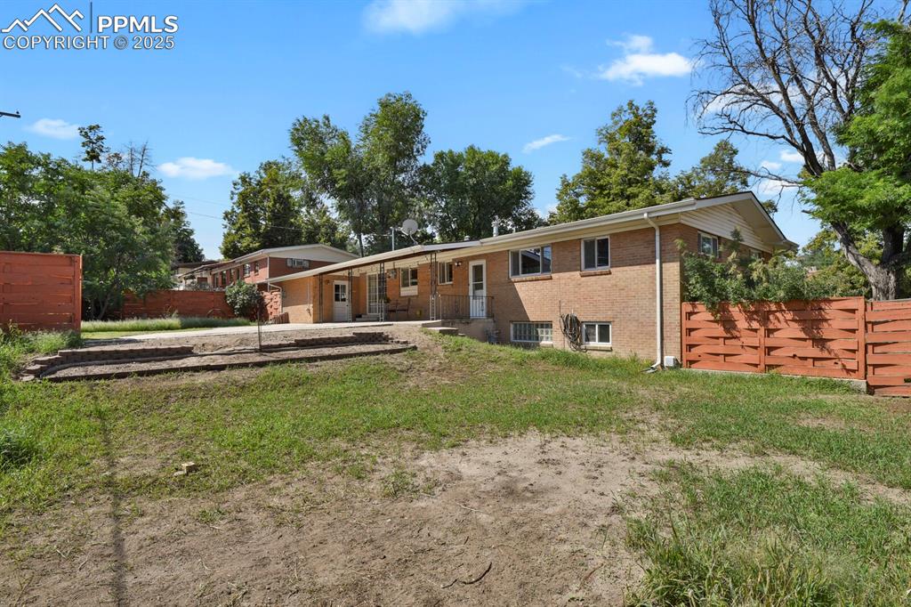 1417 Prairie Road Colorado Springs, CO 80909 - Photo 32 of 34 a view of a house with backyard