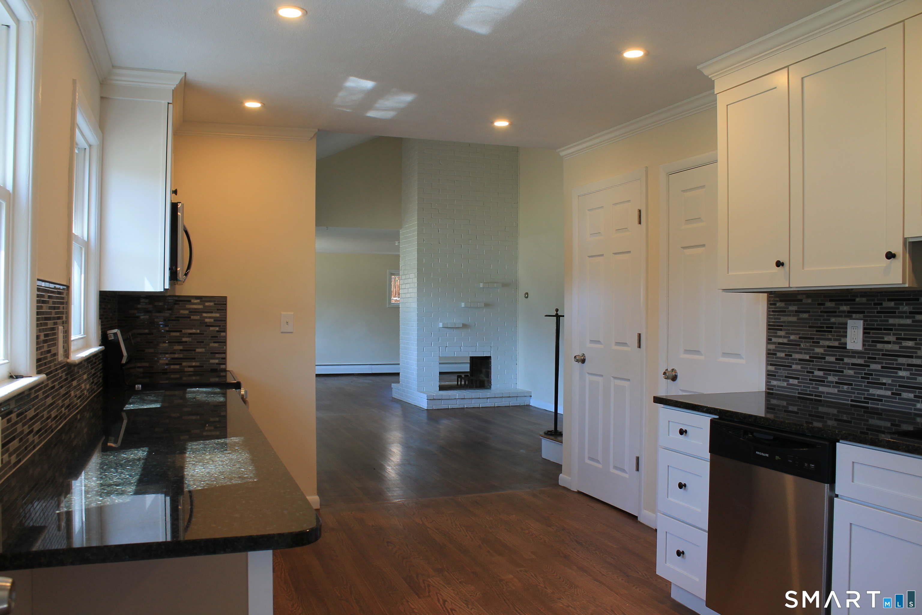 134 Sunset Street Windsor Locks, CT 06096 - Photo 4 of 23 a kitchen with stainless steel appliances granite countertop a stove a sink and a refrigerator
