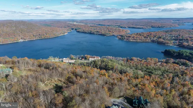 an aerial view of a houses with ocean view