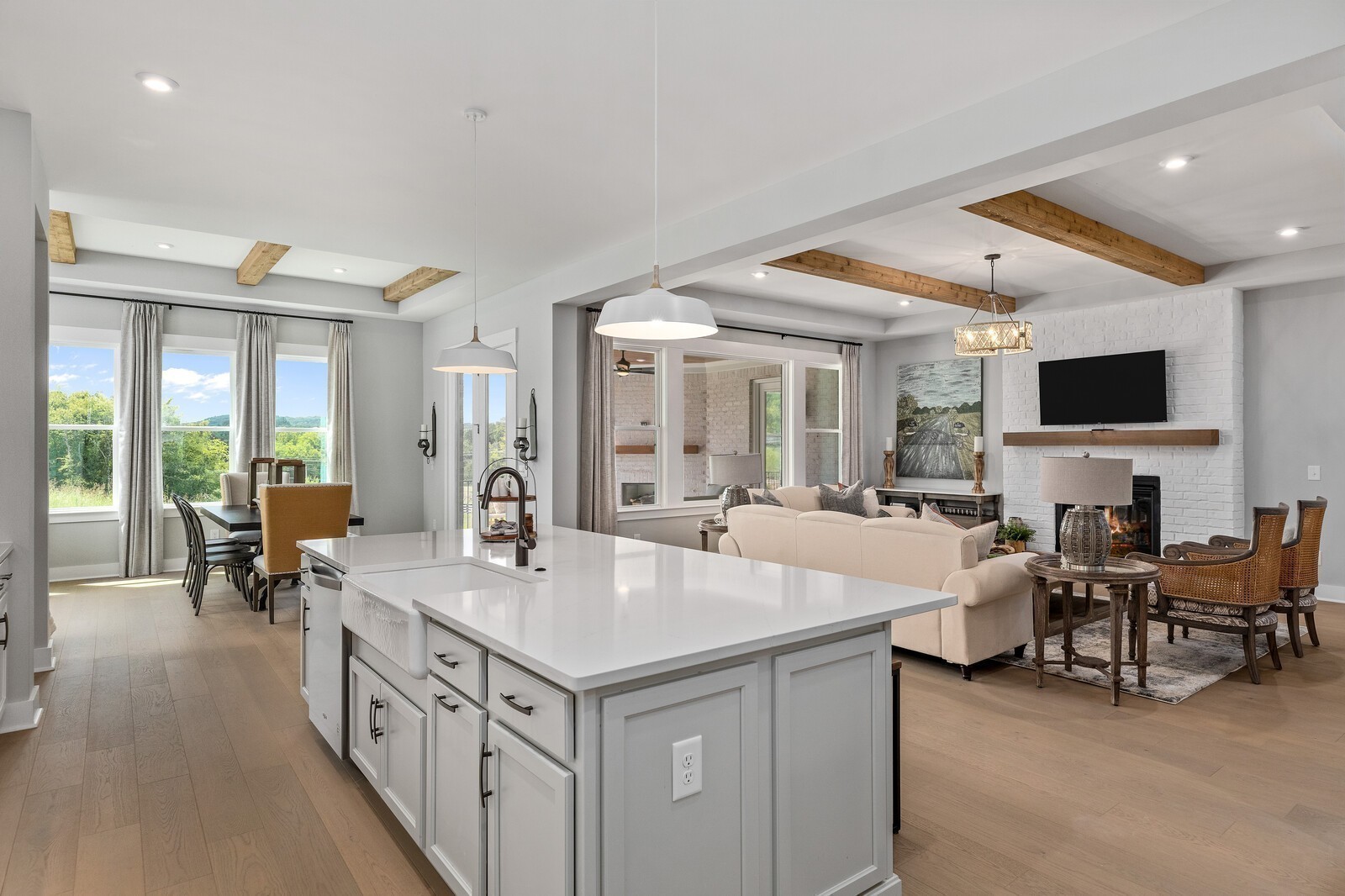 7272 Ruzek Court Fairview, TN 37062 - Photo 22 of 59 a open kitchen with stainless steel appliances kitchen island granite countertop a table and chairs in it