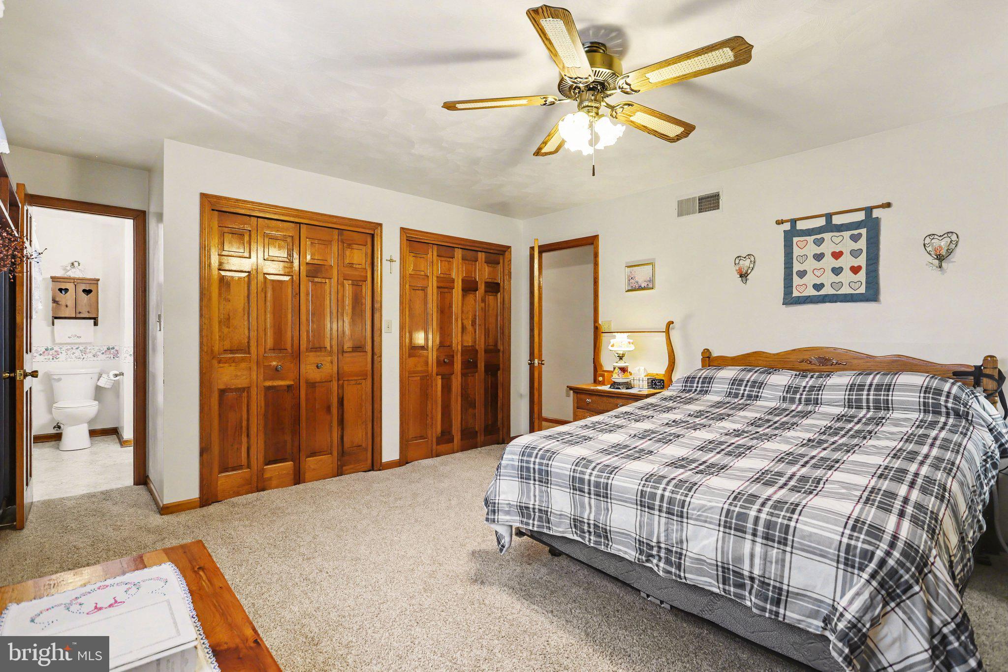 11 Narrow Road Hanover, PA 17331 - Photo 16 of 36 a bedroom with a bed and a chandelier