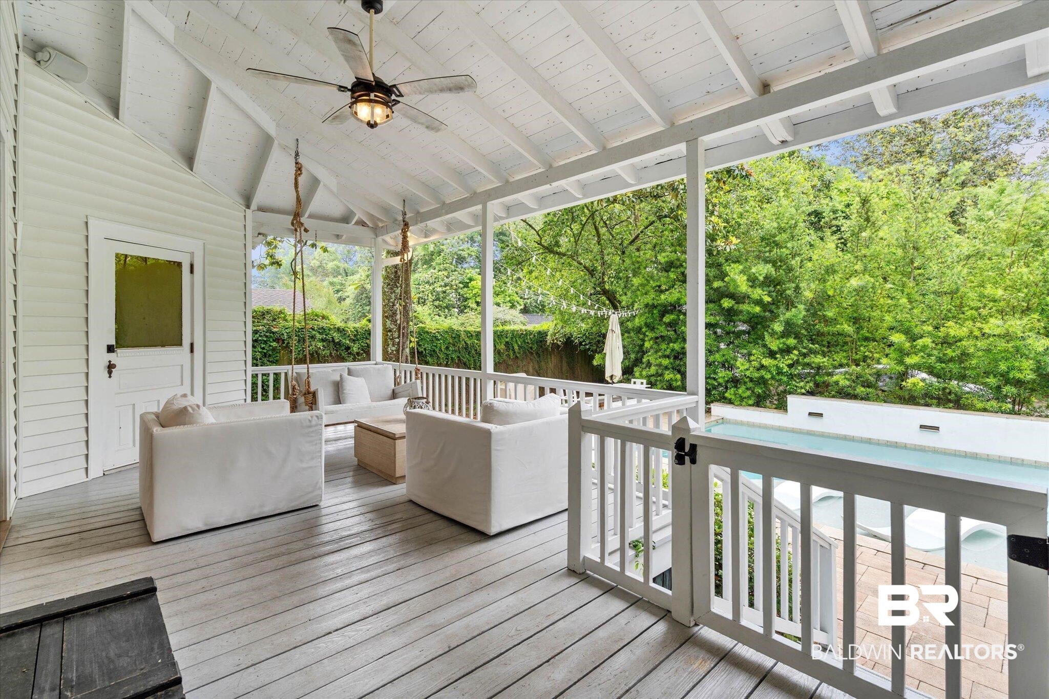 3863 Old Shell Road Mobile, AL 36608 - Photo 13 of 48 Spacious covered porch with painted wood-finish flooring, exposed beam ceiling, and a ceiling fan with light fixture