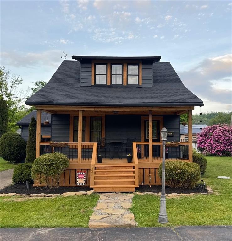 829 Oden Street Confluence, PA 15424 - Photo 1 of 13 front view of a house with a yard