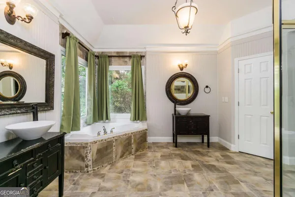 a view of a bathroom with a glass shower door