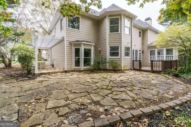 a backyard of a house with lots of green space