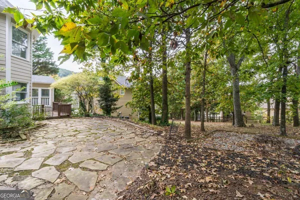 an aerial view of a house with a yard