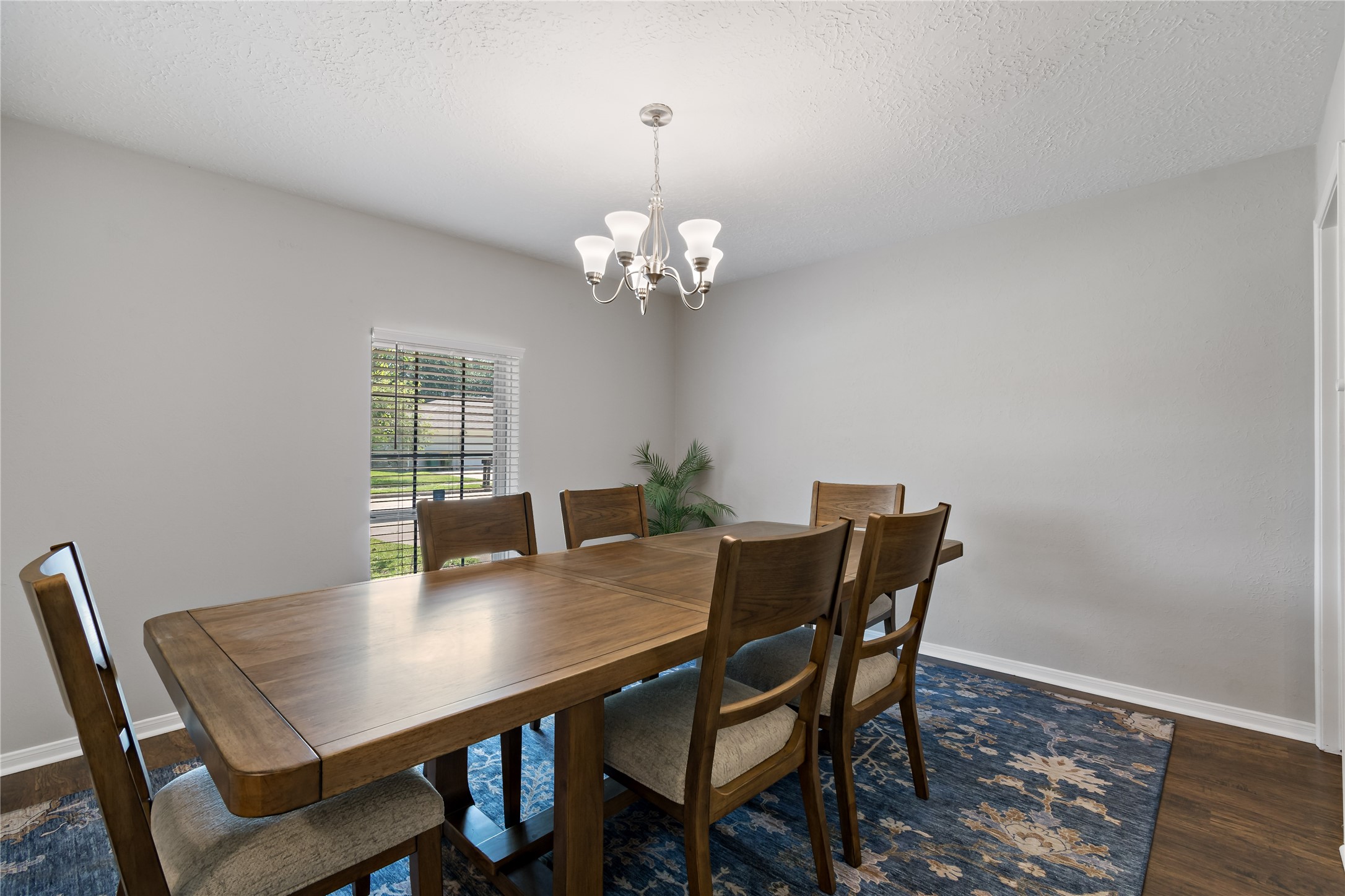 4302 Seneca Street Pasadena, TX 77504 - Photo 2 of 19 a view of a dining room with furniture and wooden floor
