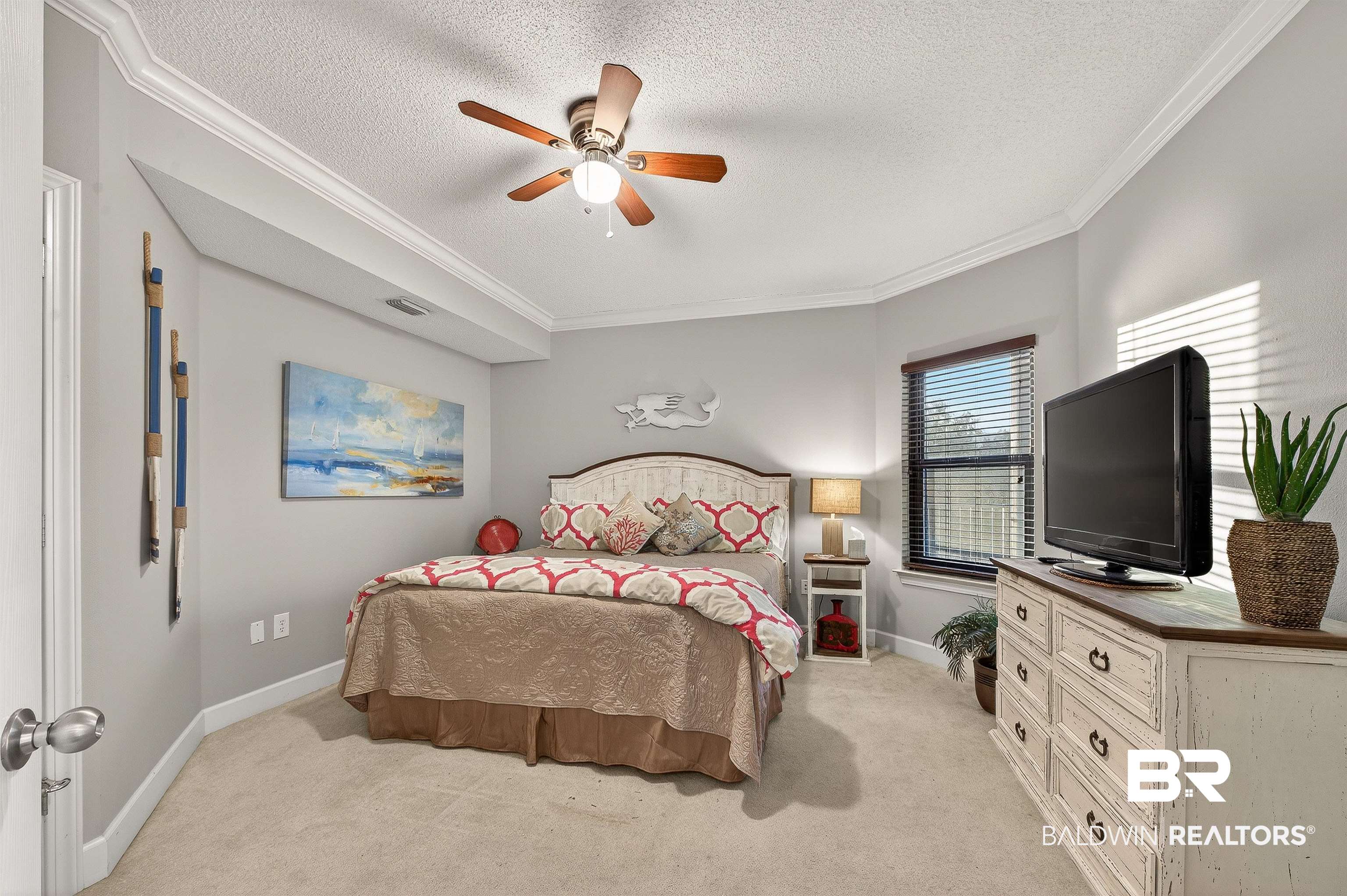 27582 Canal Road, Unit 2507 Orange Beach, AL 36561 - Photo 36 of 75 Bedroom with ornamental molding, light colored carpet, ceiling fan, and a textured ceiling