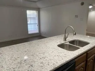 a kitchen with a sink and a window