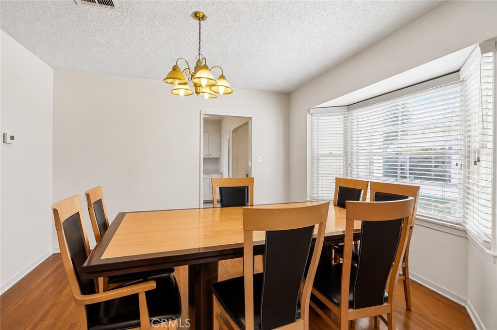 2209 Queensberry Road Pasadena, CA 91104 - Photo 13 of 44 a view of a dining room with furniture window and wooden floor
