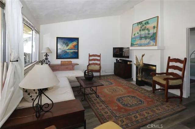 a bedroom with a bed a mirror and lamp