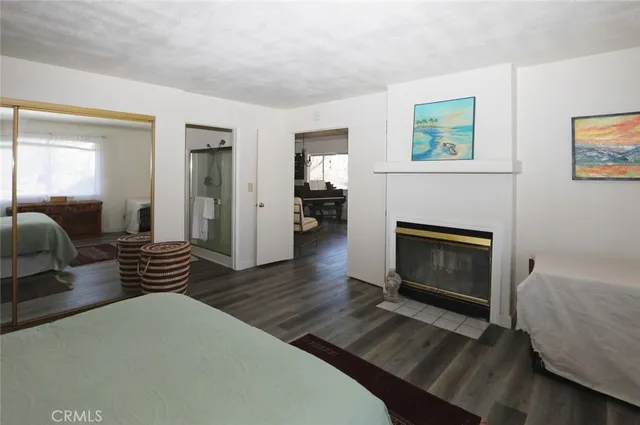 a living room with furniture a table and a floor to ceiling window