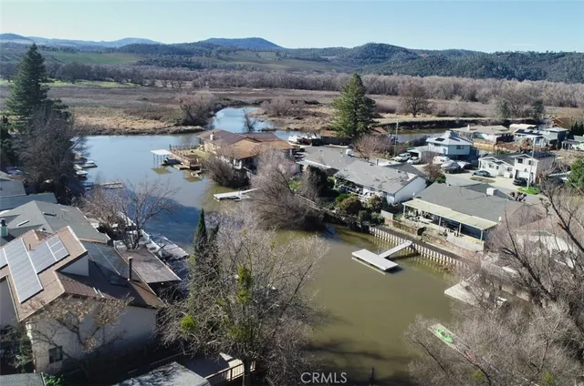 an aerial view of residential house with outdoor space and river