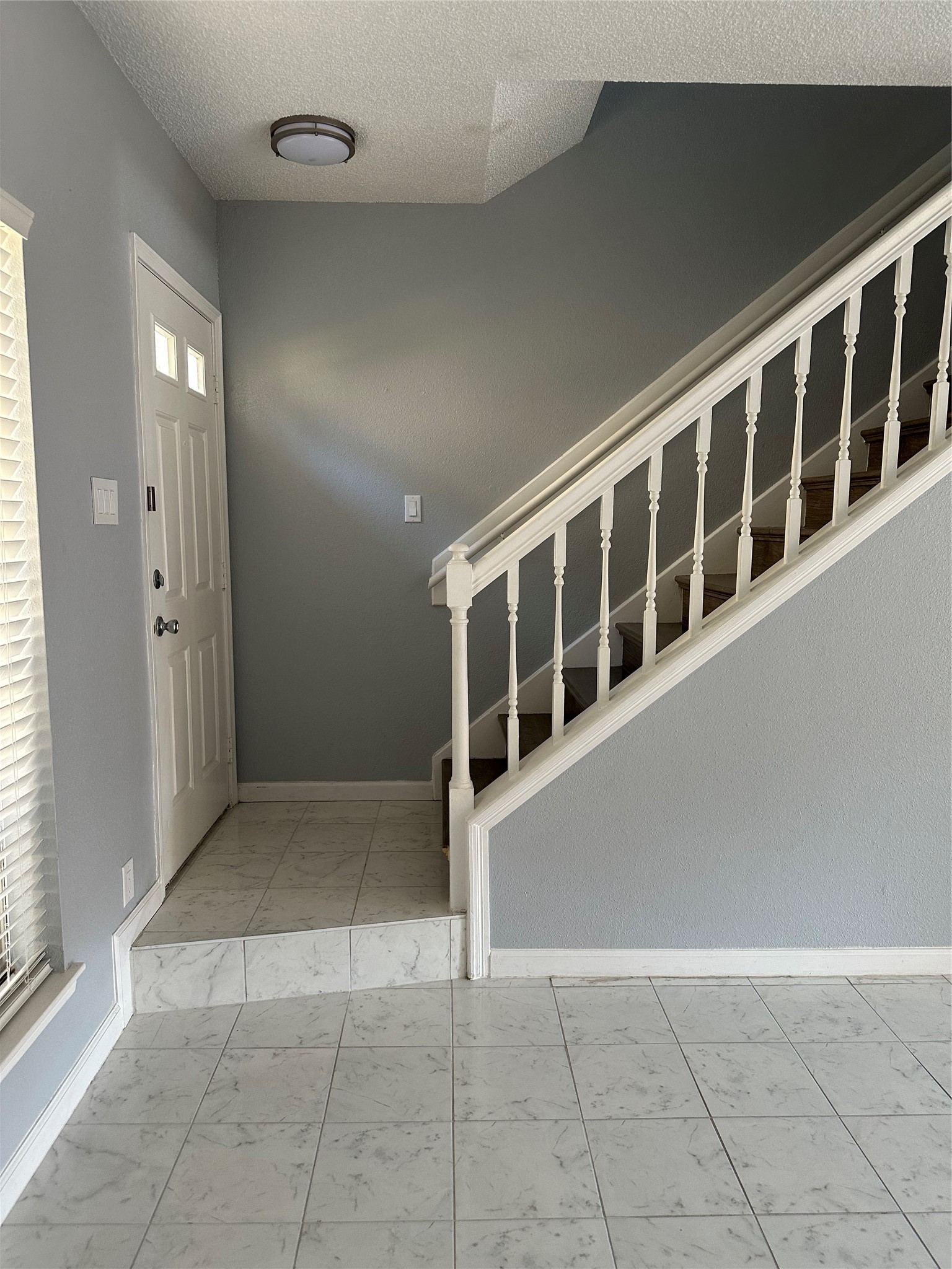 7575 Cambridge Street, Unit 2303 Houston, TX 77054 - Photo 5 of 7 a view of an empty room with wooden floor and a large window