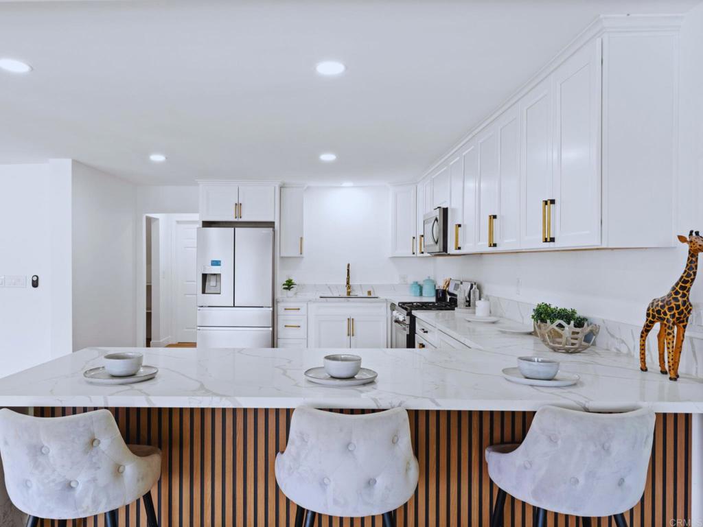 1894 Wedgemere Road El Cajon, CA 92020 - Photo 11 of 60 a view of a dining room with furniture and wooden floor