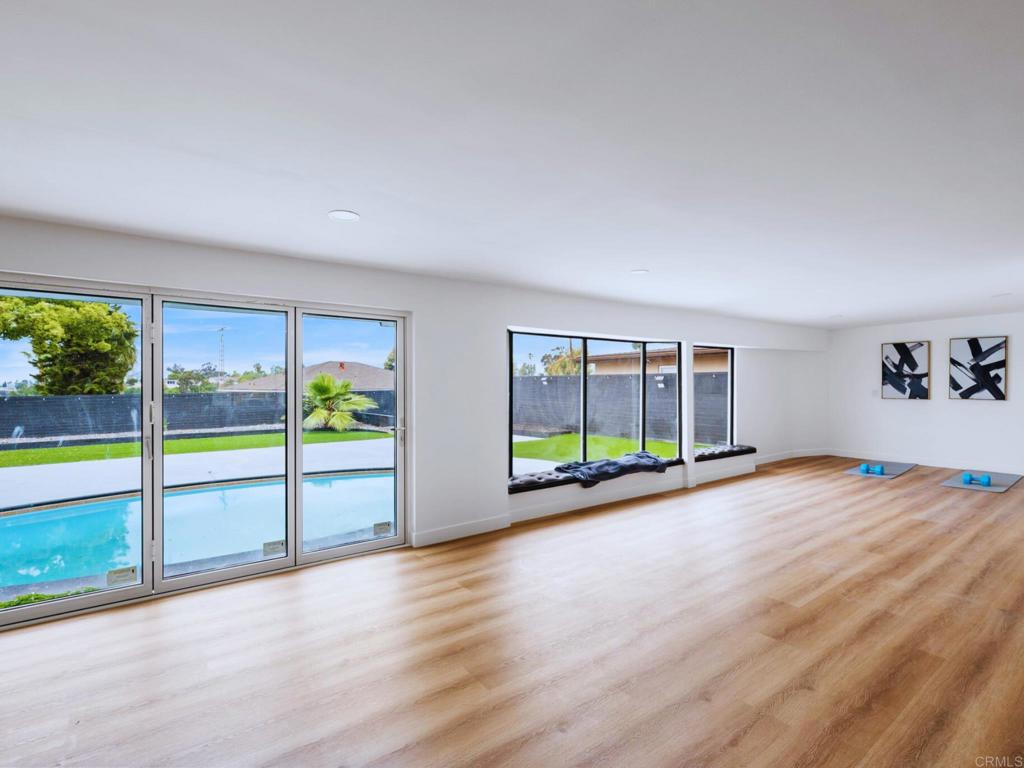1894 Wedgemere Road El Cajon, CA 92020 - Photo 19 of 60 a view of empty room with wooden floor and floor to ceiling window