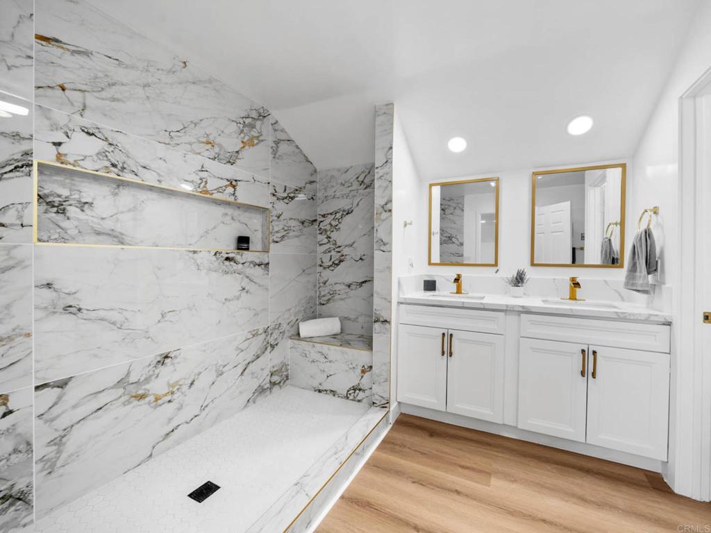 1894 Wedgemere Road El Cajon, CA 92020 - Photo 25 of 60 a bathroom with a tub sink and mirror