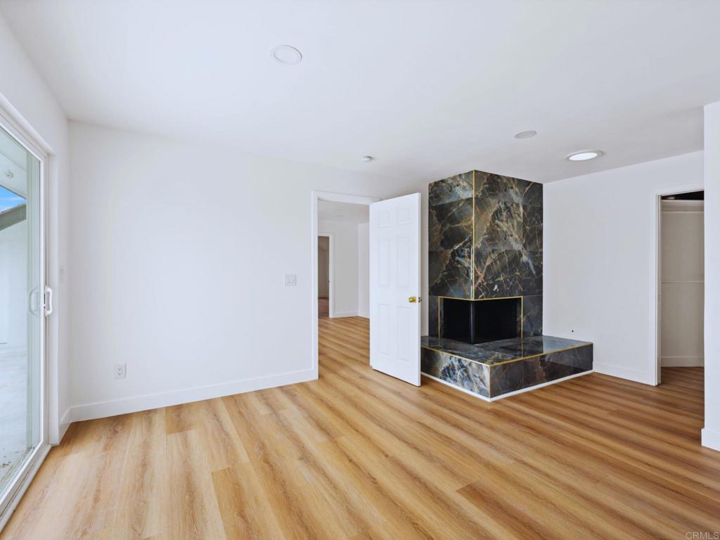 1894 Wedgemere Road El Cajon, CA 92020 - Photo 26 of 60 a view of an empty room with wooden floor and a window