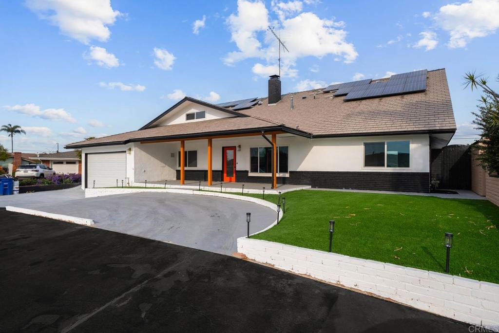 1894 Wedgemere Road El Cajon, CA 92020 - Photo 56 of 60 a front view of a house with a yard and garage